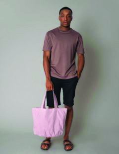 Westford Mill W345 pint garment dyed tote bag held by a male model